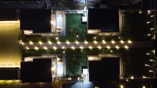 an aerial view of a building at night with lights at Araya Beach Casas in Batangas City