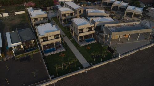 an overhead view of a group of buildings next to the water at Araya Beach Casas in Batangas City