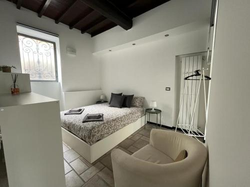 Postel nebo postele na pokoji v ubytování Loft Matteotti - Studio in centro