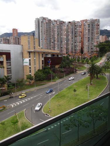 a view of a city street with cars on the road at Hotel bh El Poblado in Medellín