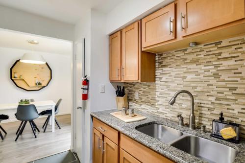 a kitchen with a sink and a counter top at Serene Dallas Vacation Rental - Walkable Location! in Dallas