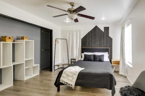a bedroom with a bed and a ceiling fan at Serene Dallas Vacation Rental - Walkable Location! in Dallas