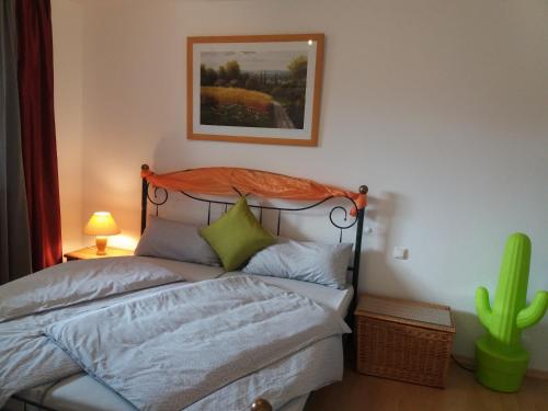a bedroom with a bed and a cactus at Ferienwohnung im Pfaffenwinkel in Weilheim in Oberbayern