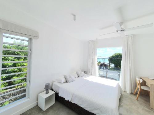 Ένα ή περισσότερα κρεβάτια σε δωμάτιο στο Cozy pavillon with private jacuzzi on rooftop terrace - Jolly's Rock