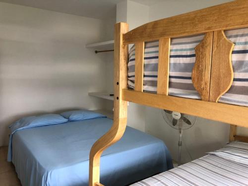 a pair of bunk beds in a room at Pangora, habitación privada de Flor de Lis Beach House in Playas