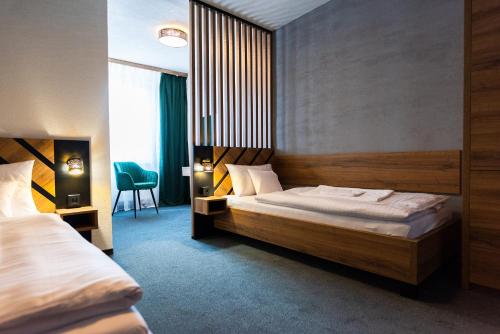 Postel nebo postele na pokoji v ubytování Hotel Carrera