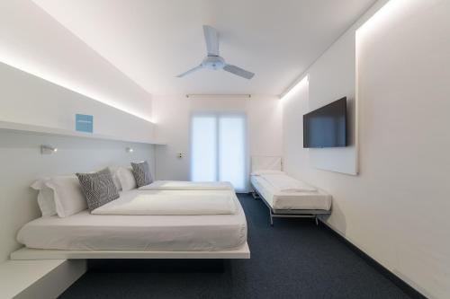 Postel nebo postele na pokoji v ubytování Hotel Santoni Freelosophy ***