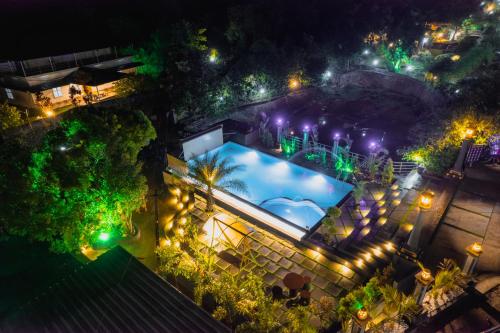 an overhead view of a swimming pool at night at Rock Hut Tabor Hills Resort Vagamon in Vagamon