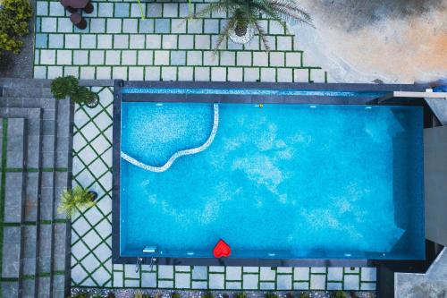 an overhead view of a swimming pool in a building at Rock Hut Tabor Hills Resort Vagamon in Vagamon