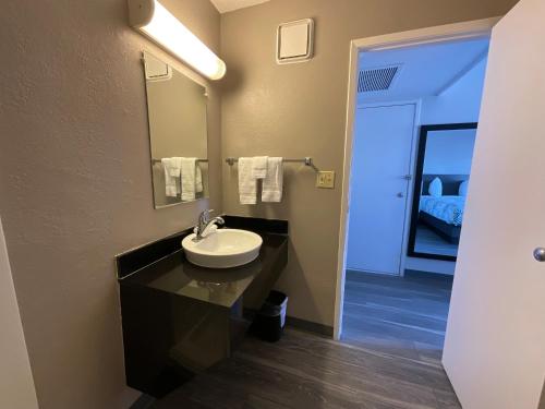 a bathroom with a sink and a mirror at Motel 6-Ely, NV in Ely