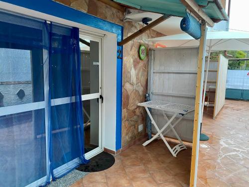 a house being constructed with a sliding glass door at L'Oasi di Chia in Chia