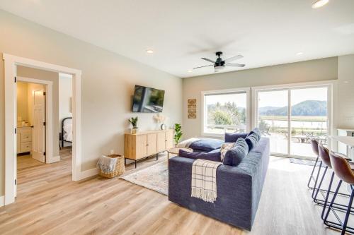 a living room with a couch and a window at Charming Florence Home with Fire Pit and River Views! in Florence