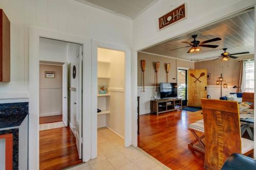 a living room with a kitchen and a dining room at NEW Paddler's Inn- 3BR Hilo Downtown in Hilo