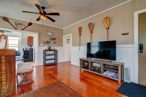 a large living room with a flat screen tv at NEW Paddler's Inn- 3BR Hilo Downtown in Hilo