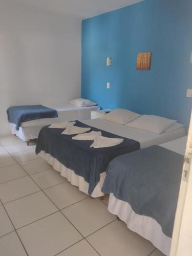 Katil atau katil-katil dalam bilik di Hotel Portal da Praia