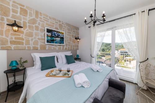 Postel nebo postele na pokoji v ubytování Tilagus holiday villa - Perla