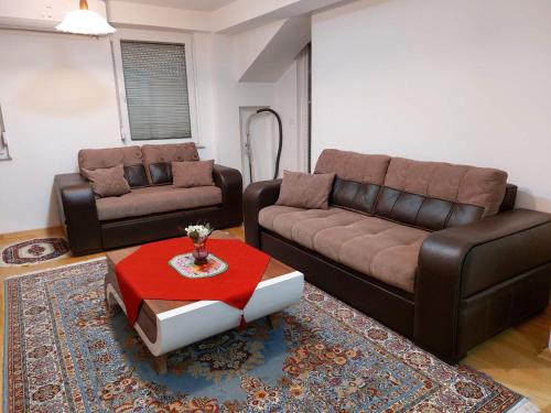 a living room with a couch and a coffee table at Apartment JOANA Ohrid center in Ohrid