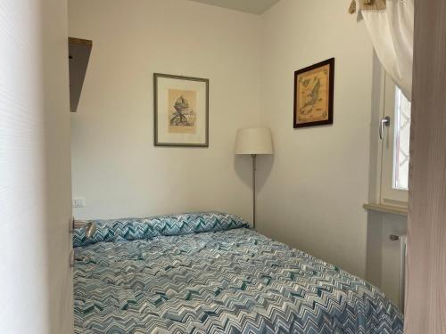 Una cama o camas en una habitación de Bardolino Lake Apartments