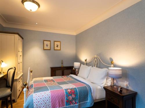 Katil atau katil-katil dalam bilik di The Whispering Pine Lodge