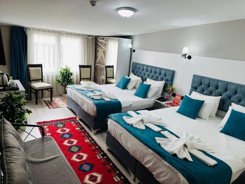 Ένα ή περισσότερα κρεβάτια σε δωμάτιο στο Galapera Hotel