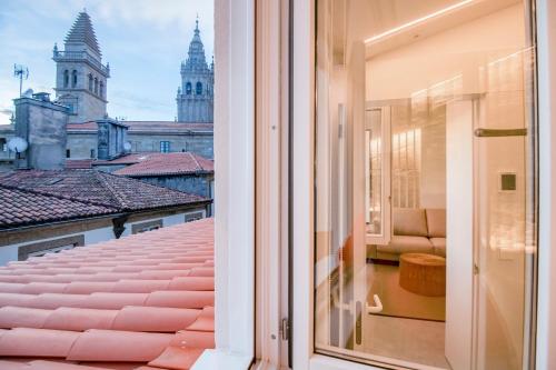 a balcony with a view of a city at Apartamentos Atia Catedral in Santiago de Compostela