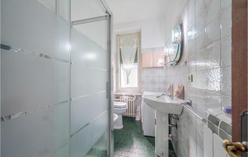 a bathroom with a shower and a sink and a toilet at Amazing Apartment In Borghetto Di Borbera - With Wifi And 2 Bedrooms in Borghetto Di Borbera