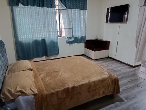 Ein Bett oder Betten in einem Zimmer der Unterkunft Ecualodge VIII. LOVELY SUITE WITH FREE PARKING
