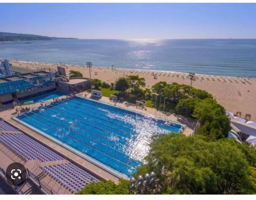 an overhead view of a swimming pool next to a beach at City-Centre Studio 2 in Varna City