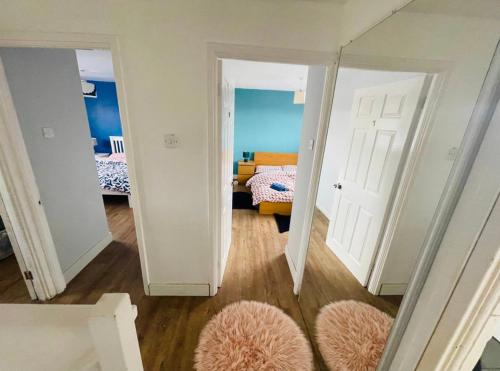 a hallway with two doors and a room with a bedroom at Mia Property 2 in Bristol