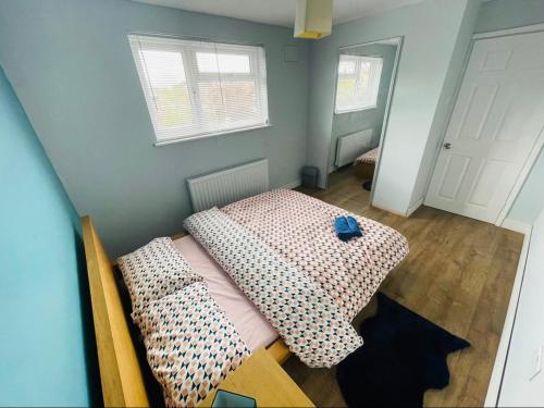 a bedroom with a bed and two pillows on it at Mia Property 2 in Bristol