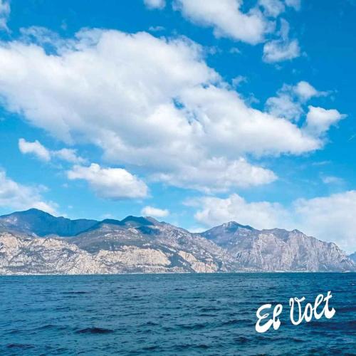 a view of the ocean with mountains in the background at EL VOLT in Malcesine
