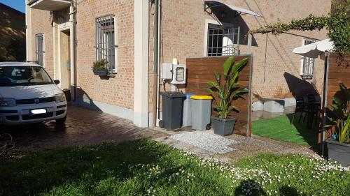 a car parked in the driveway of a house at Il Giardino Home in Lippo di Calderara di Reno