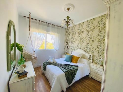 a bedroom with a bed and a mirror at Bodega Sibeiro in Chantada