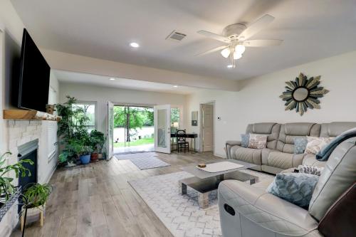 a living room with a couch and a fireplace at Kingwood Cottage - 10 mins from IAH - Lake Front in Humble