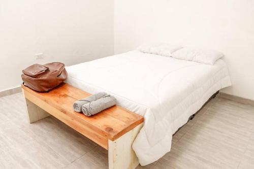 Un pat sau paturi într-o cameră la Casa Centro Guaduas