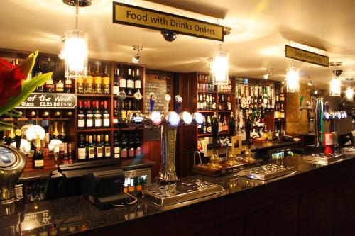 a bar with a lot of bottles of alcohol at The Angel View Hotel in Gateshead
