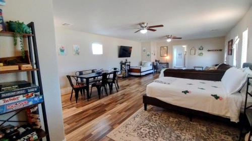 a living room with a couch and a table at Falcon Cottage in Pahrump