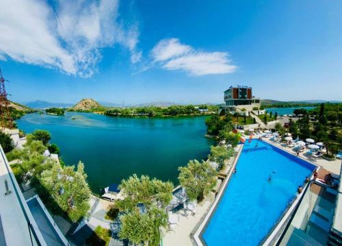 arial view of a river with a swimming pool at PRINCIPE DEL LAGO in Shkodër