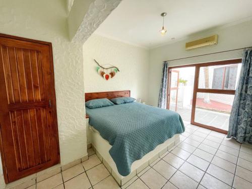 Postel nebo postele na pokoji v ubytování Hotel Allende