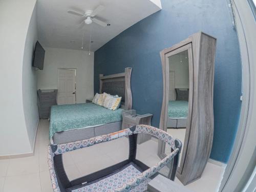 a bedroom with two twin beds and a mirror at Depa el señor in Ciudad Guzmán