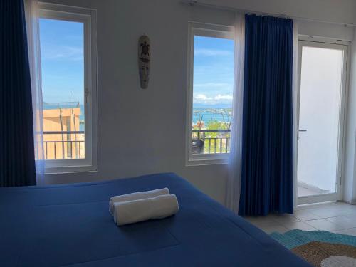 Postel nebo postele na pokoji v ubytování Blue Ocean Hotel