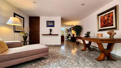 a living room with a couch and a table at Casa Tamayo in Mexico City
