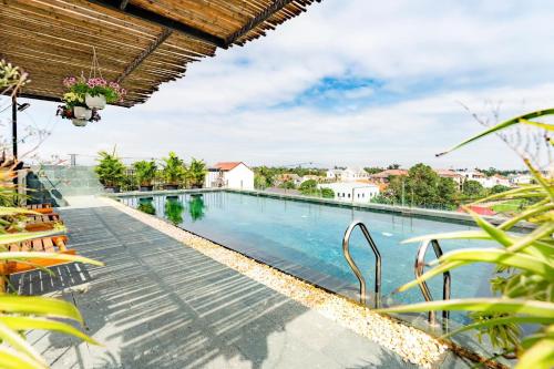 a swimming pool at a villa with a view at Nam An Mama Villa Hoi An in Hoi An