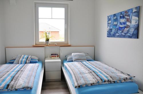 Llit o llits en una habitació de Petersdorf Haus Smilla