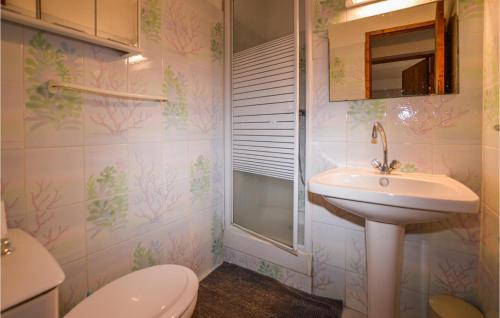 a bathroom with a sink and a toilet at Lovely Apartment In Carcheto Brustico With Outdoor Swimming Pool in Carcheto