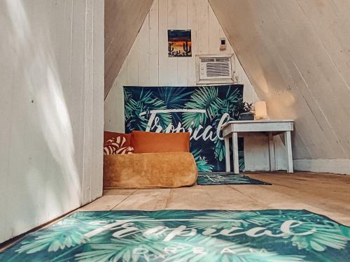 a living room with a couch and a table at MyLove Siargao Village in General Luna