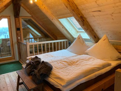a bed in the attic of a cabin at Blockhaus PanHütte in Braunlage