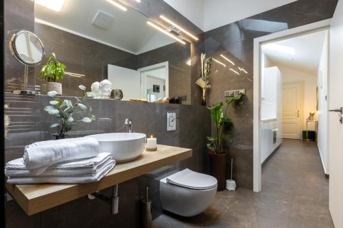 a bathroom with a sink and a toilet at Luxurious, charming studio perfect for couples in Prague