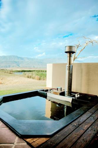 a pool of water on top of a table at Kwetu Guest Farm in Swellendam
