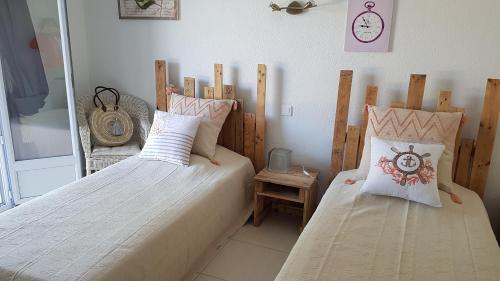Posteľ alebo postele v izbe v ubytovaní Rez de Villa, vue magnifique, piscine chauffée privée, spa villa Les Feuillantines